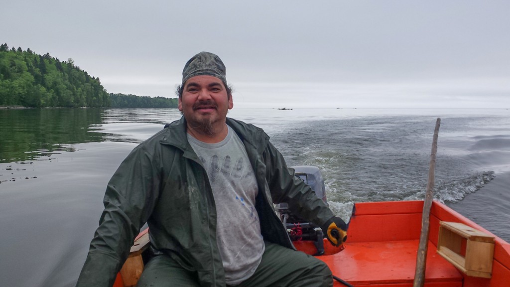 Ronnie Condo of Gesgapegiag First Nation at the Cascapedia working with ASF researchers recently to deploy receivers that track Cascapedia smolts beginning their migration. The Cascapedia acheived more than 300 per cent of its base conservation level last year. (Photo Michelle Charest/ASF)