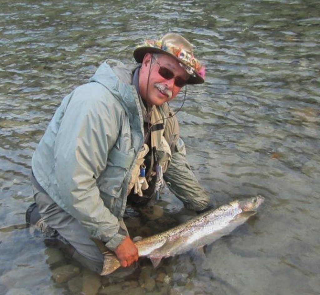 Lewis Hinks releases an Atlantic salmon in one of the rivers of the northeast Gaspé Peninsula. Photo Carl Purcell.