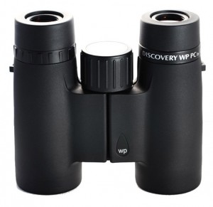Opticron Discovery WP PC 8x32 are only 14 oz., and just 4.3 x 4.6 in., but too big for a vest pocket. Tackle Box size instead.